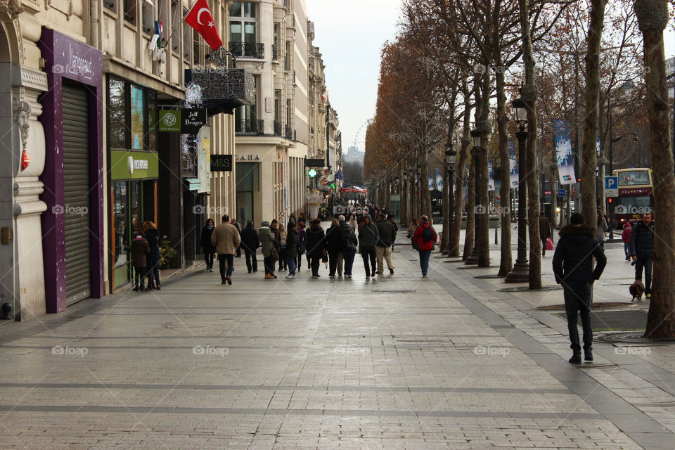 Crowd on the sidewalk in the city of Paris