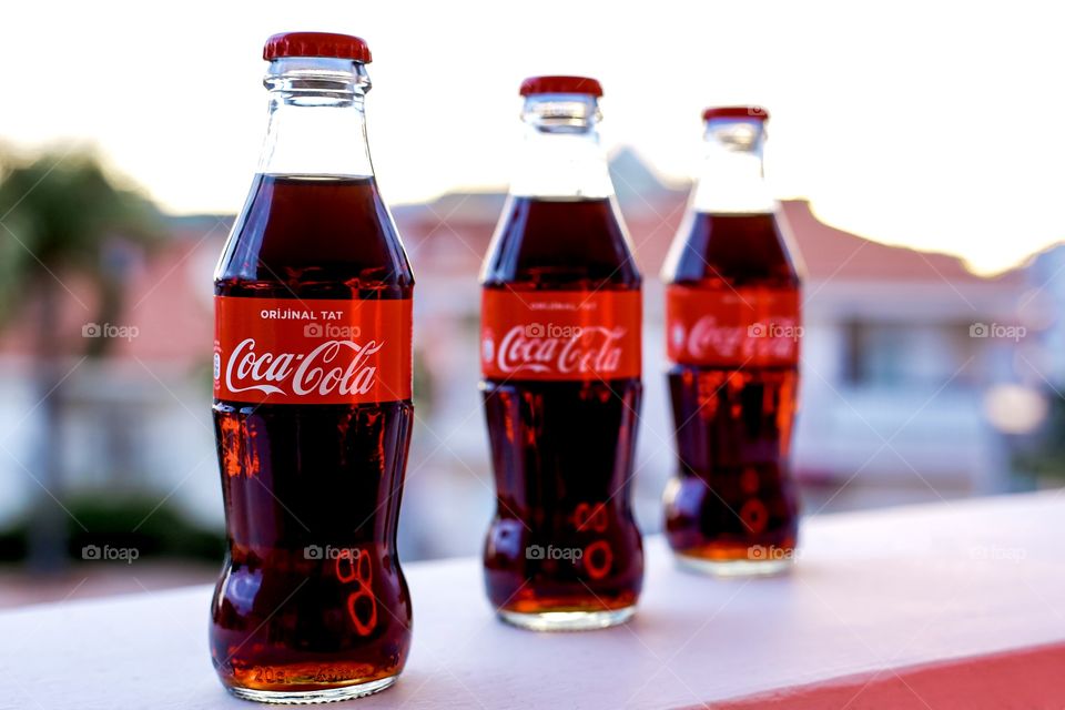 Three bottles of Coca Cola 