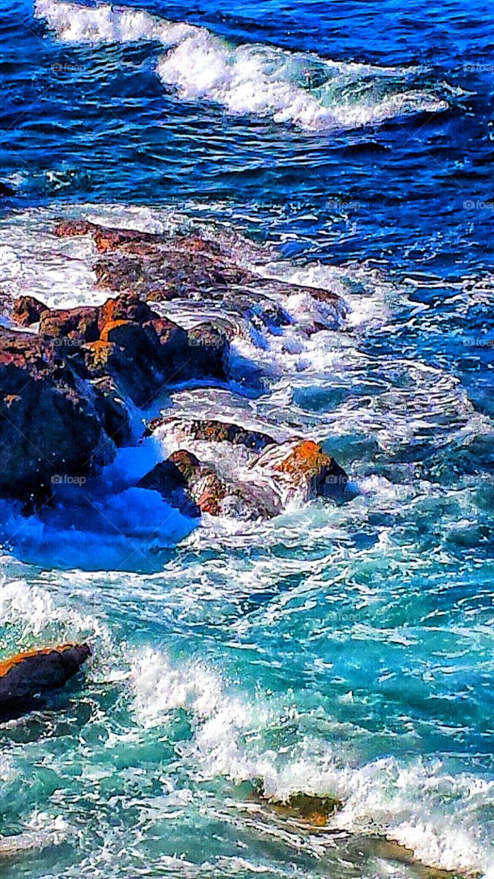 Crashing Waves. High tide at Heisler park in Laguna Beach.