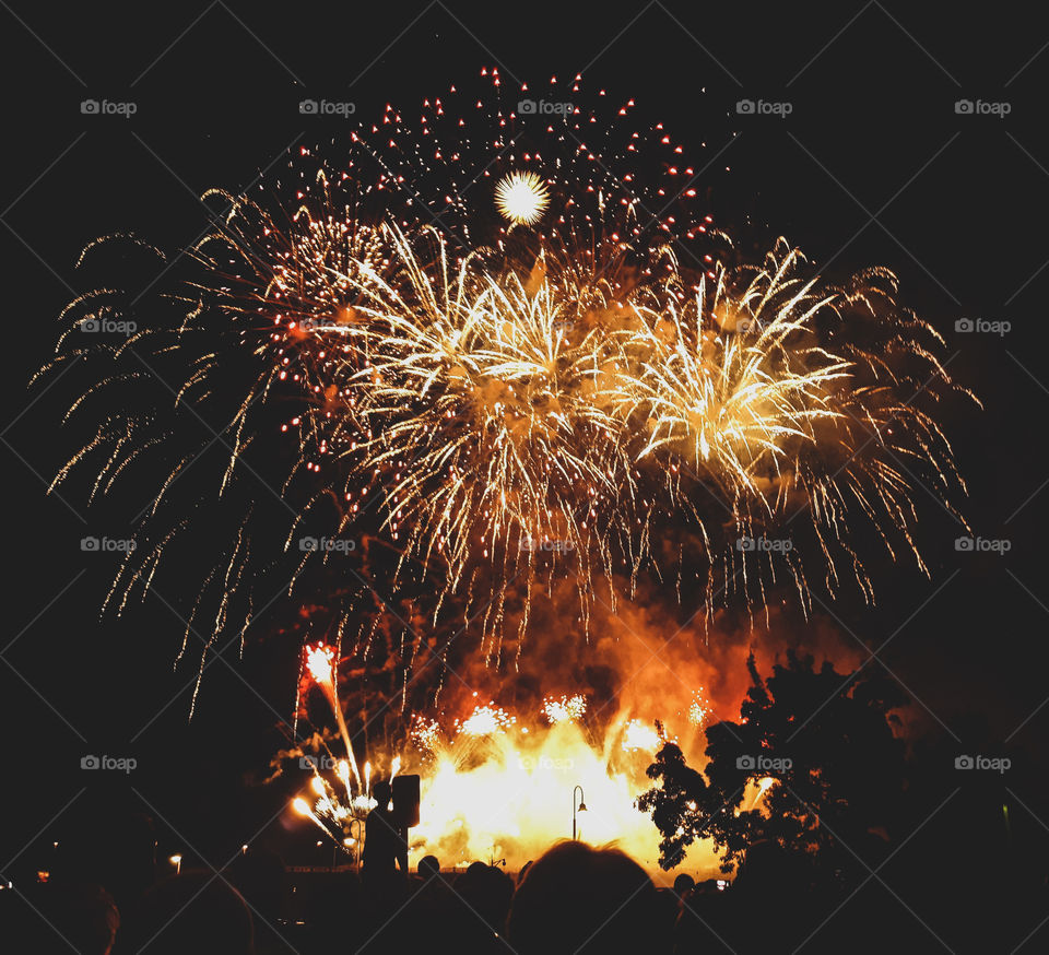 Photograph of The Minneapolis Aquatennial fireworks display. Downtown Minneapolis, overlooking the Mississippi River, in Minnesota.