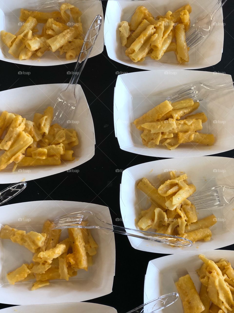 Close up shots of ready-to-eat rich, creamy yellow macaroni and cheese.