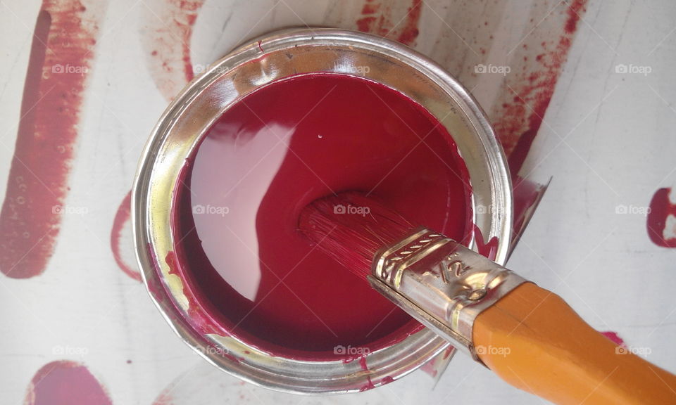 High angle view of paintbrush on steel bowl