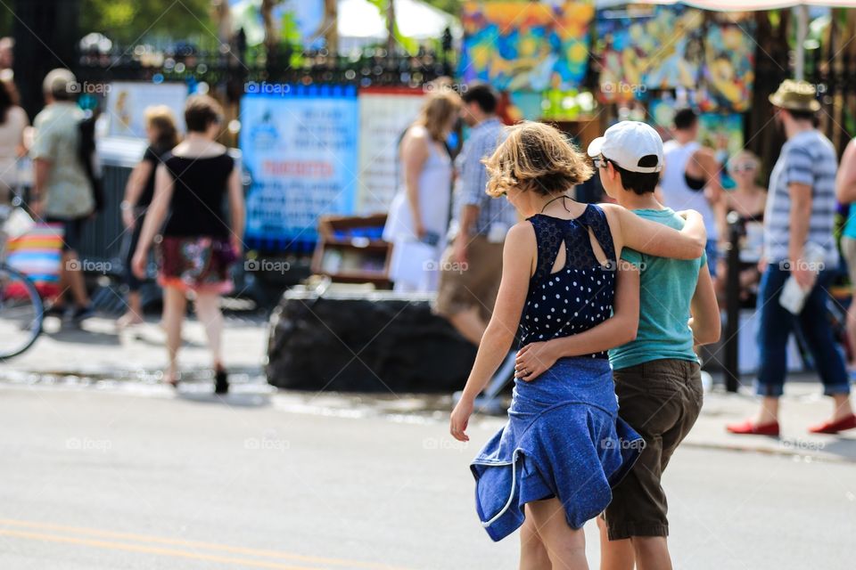 Lover friend hug each other in the street 