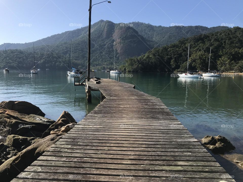 wooden pier for embarkation and disembarkation at Sitio Forte cove, in Ilha Grande, Rio de Janeiro