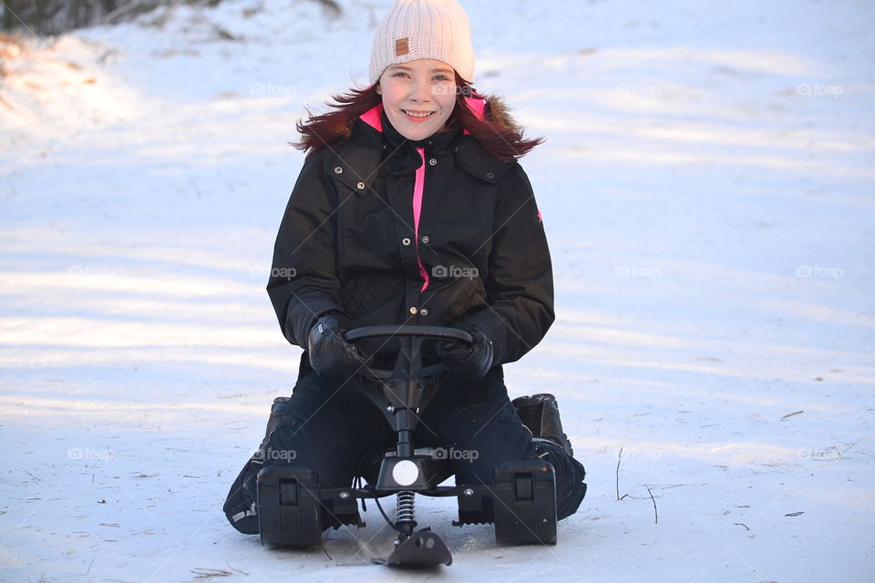 Girl sledding