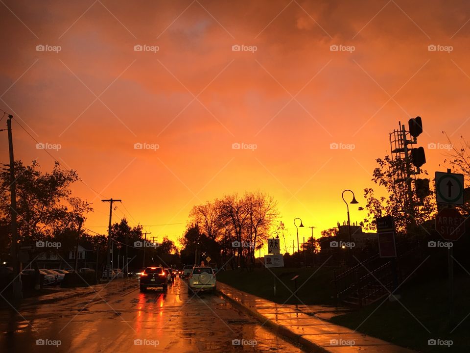 Autumn sunset on a wet road in fall 