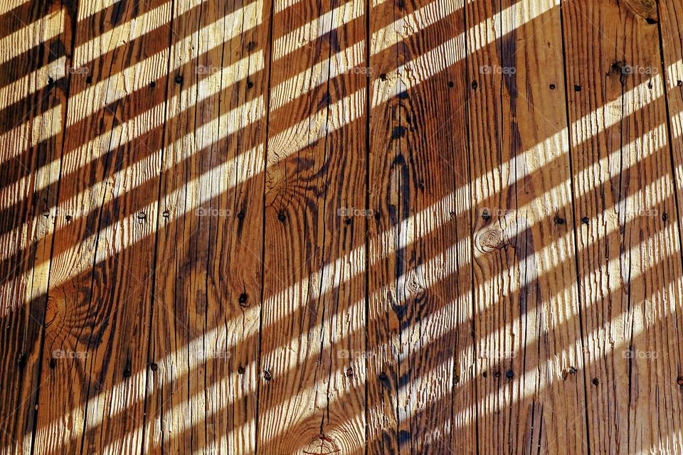 Sunlight and shadows on timber 