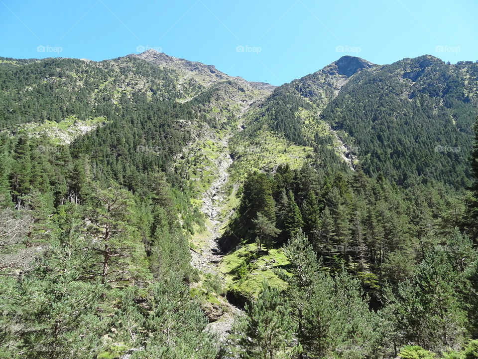 Rocky waterfall across mountain