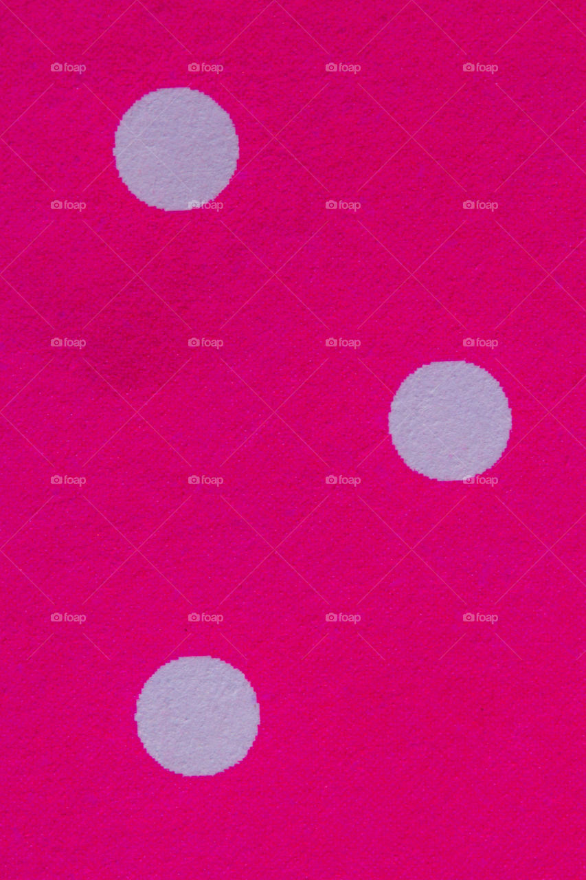 withe polca dots on pink paper