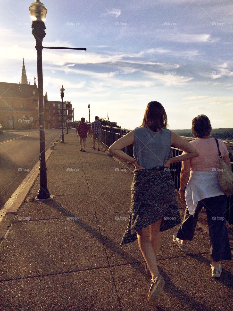 The beauty of generations! Granddaughter walking with grandmother, grandson-in-law walking with grandfather 