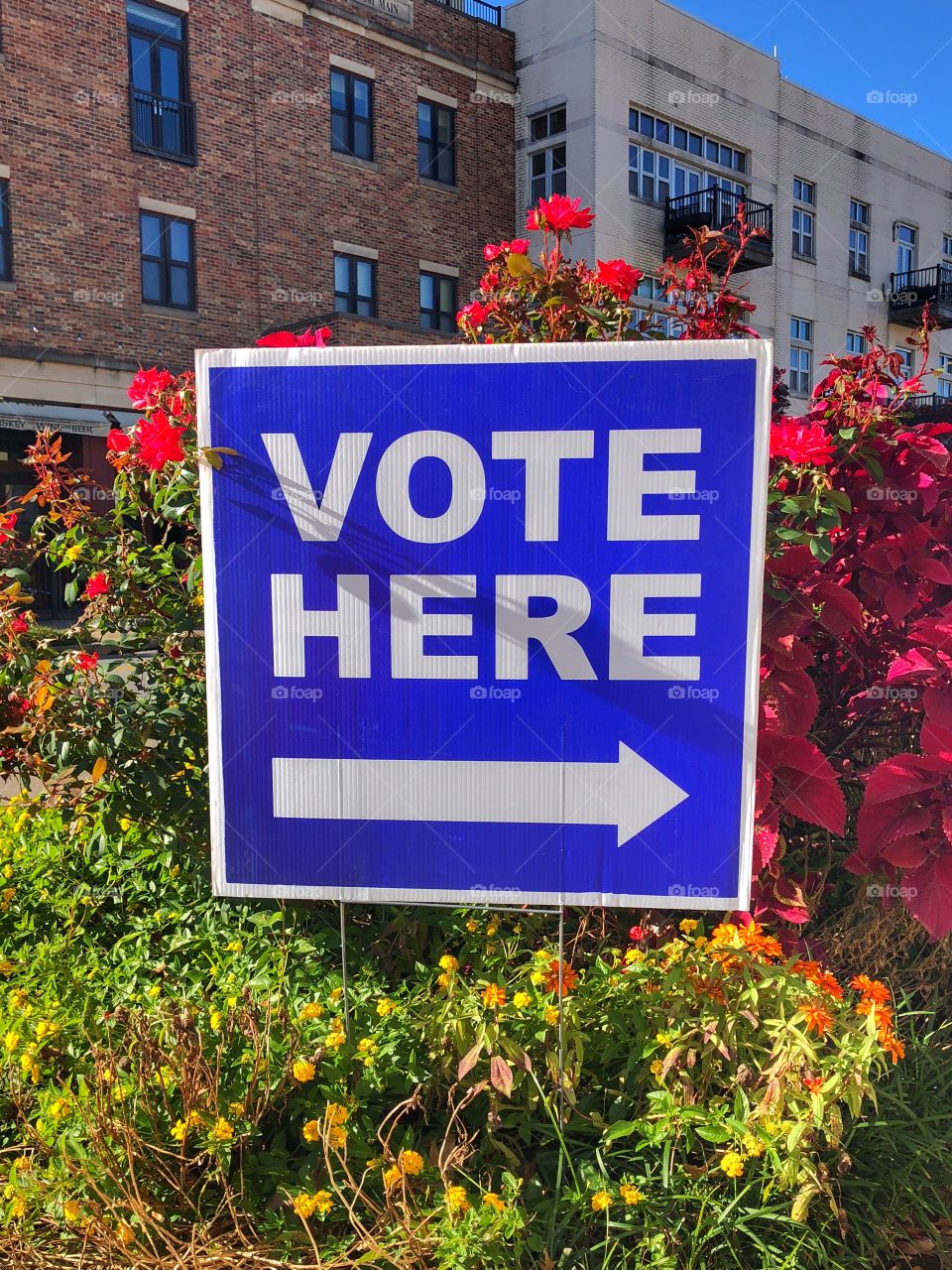 Vote Here - On Election Day,  November 6th 2018, a blue and white sign outside a southern city, North Little Rock Arkansas, indicates to citizens where they can cast their vote. 
