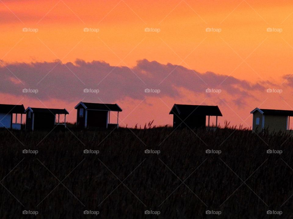 Beachhuts in sunset