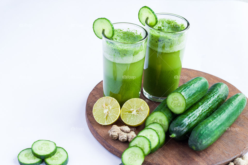 Green cucumber juice isolated on white background.