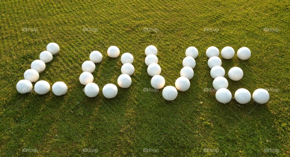 Balls arranged in a word love on grass