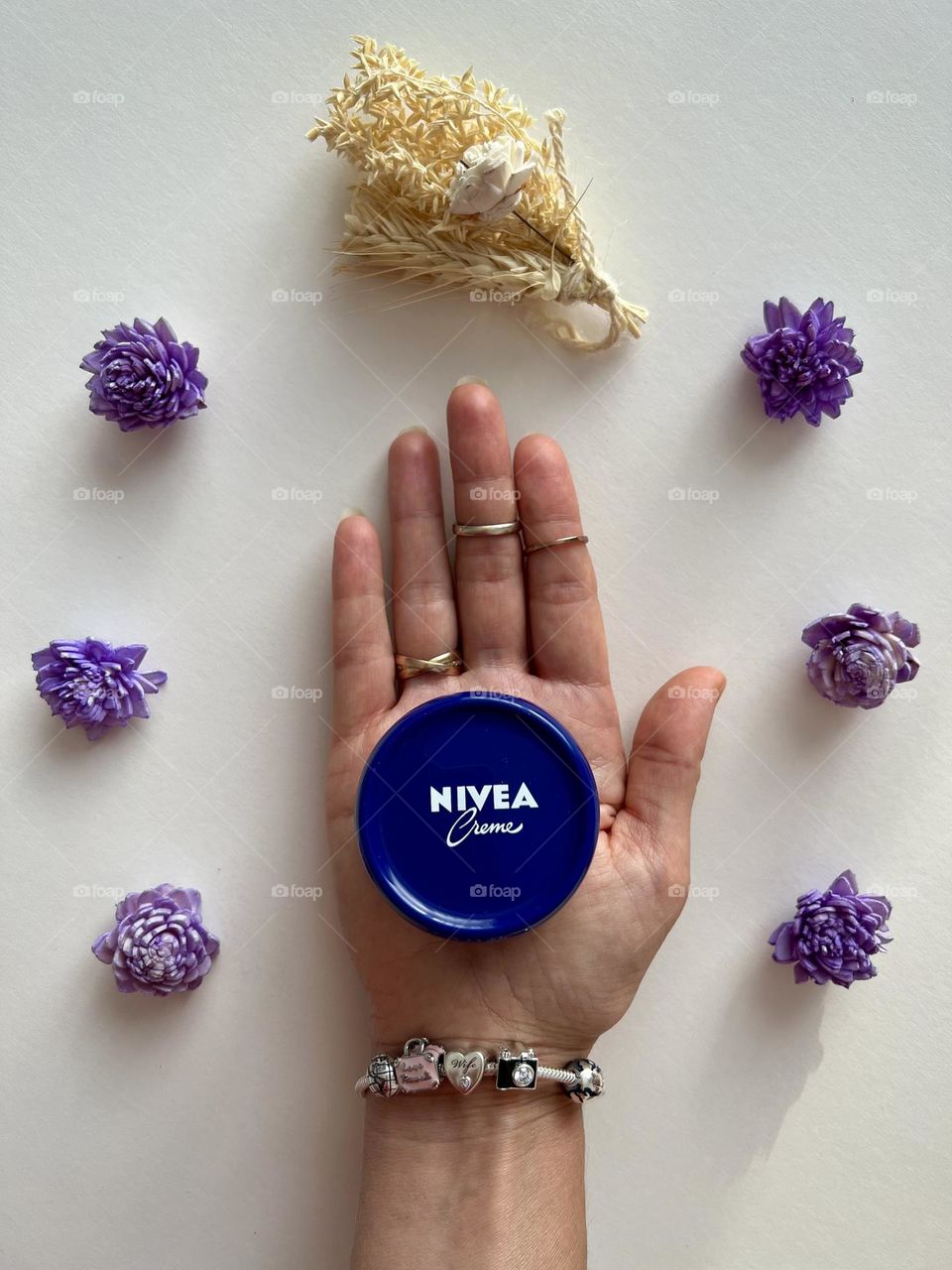 Cosmetic, hand holding the Nivea cream, famous beauty brand.