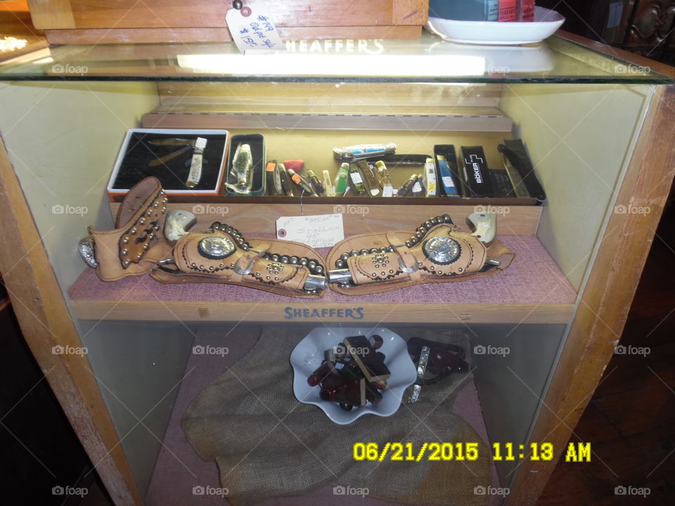 colt forty-five. This is a picture of some colt forty-fives on display in a gift shop in Weatherford Texas