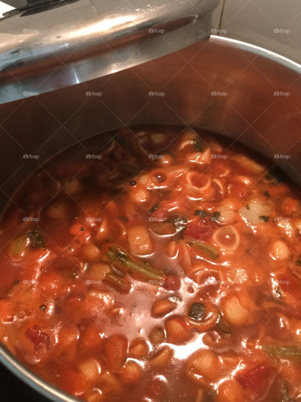 Italian minestrone soup closeup in pan