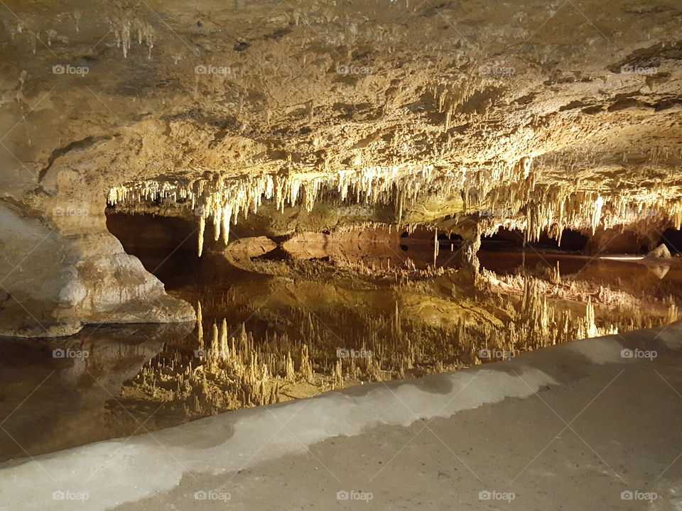 Cavern Mirror. Bed of water in a cavern giving a perfect mirrored image of the cavern above it.
