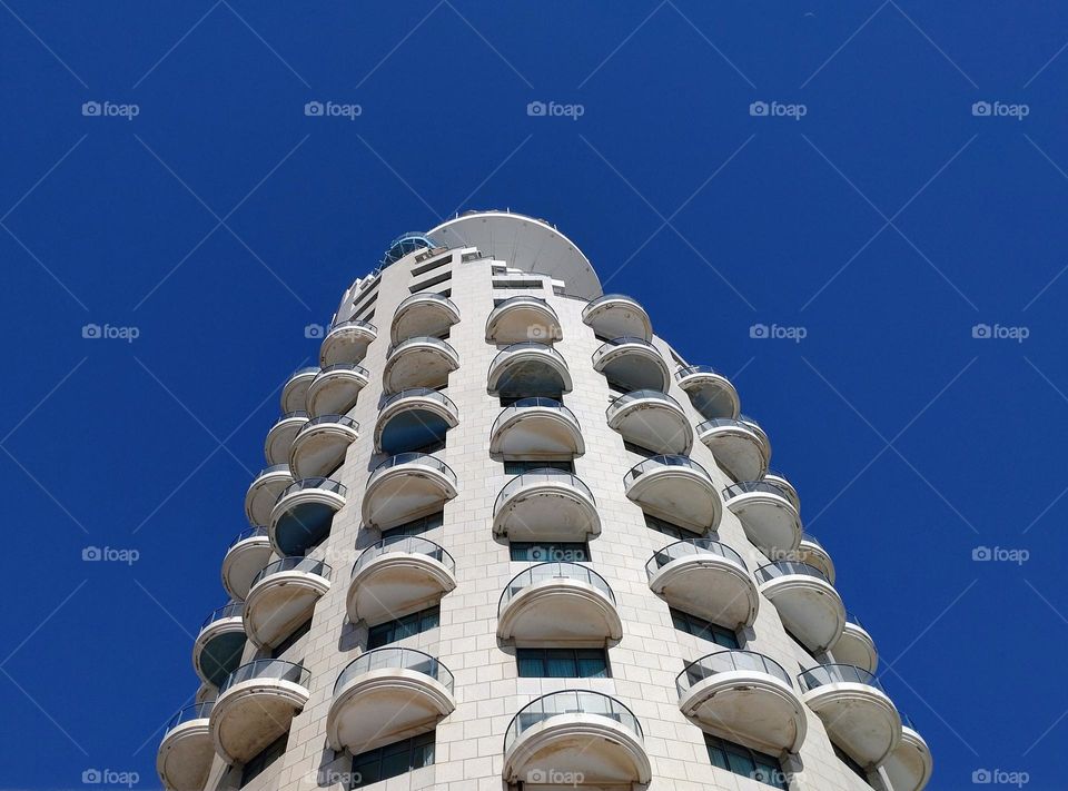 Building 🏢 Blue sky 🩵 Balconies🏢 Skyscraper🏢