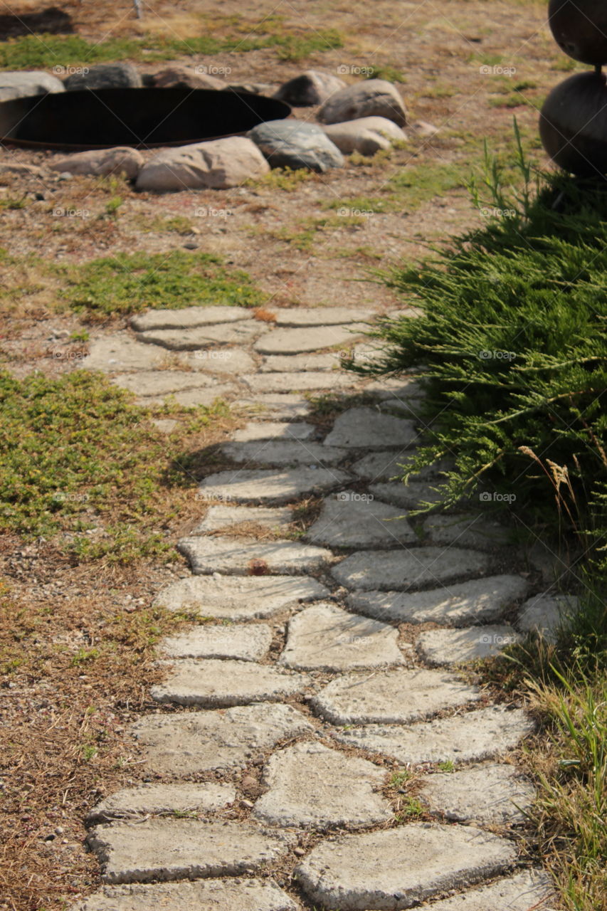 Stone trail leading to stone fire pit