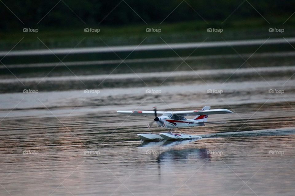 Toy airplane lands on water 