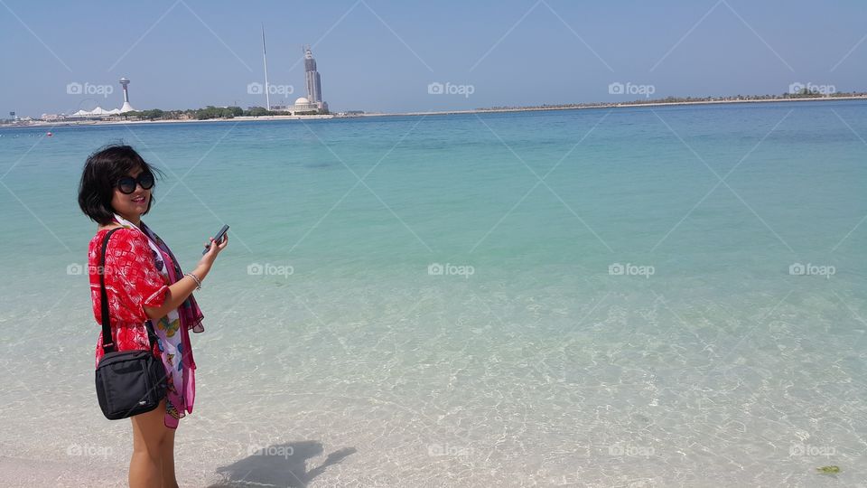 Love the Beach. Lady enjoying the waters of Abu Dhabi beach