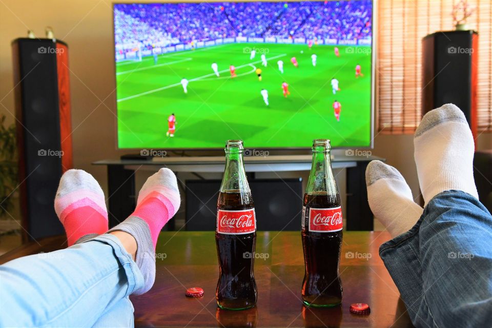 Watching football with Coke