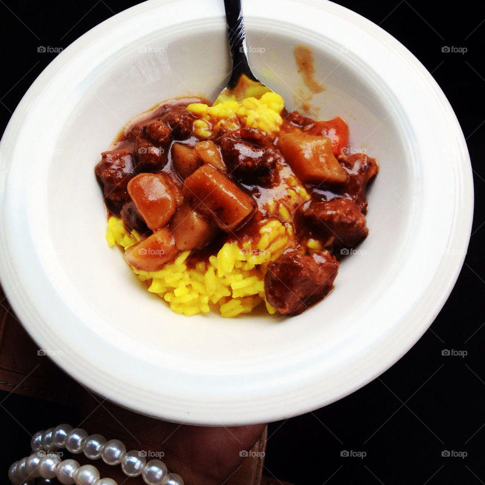 Beef stew and rice in a bowl