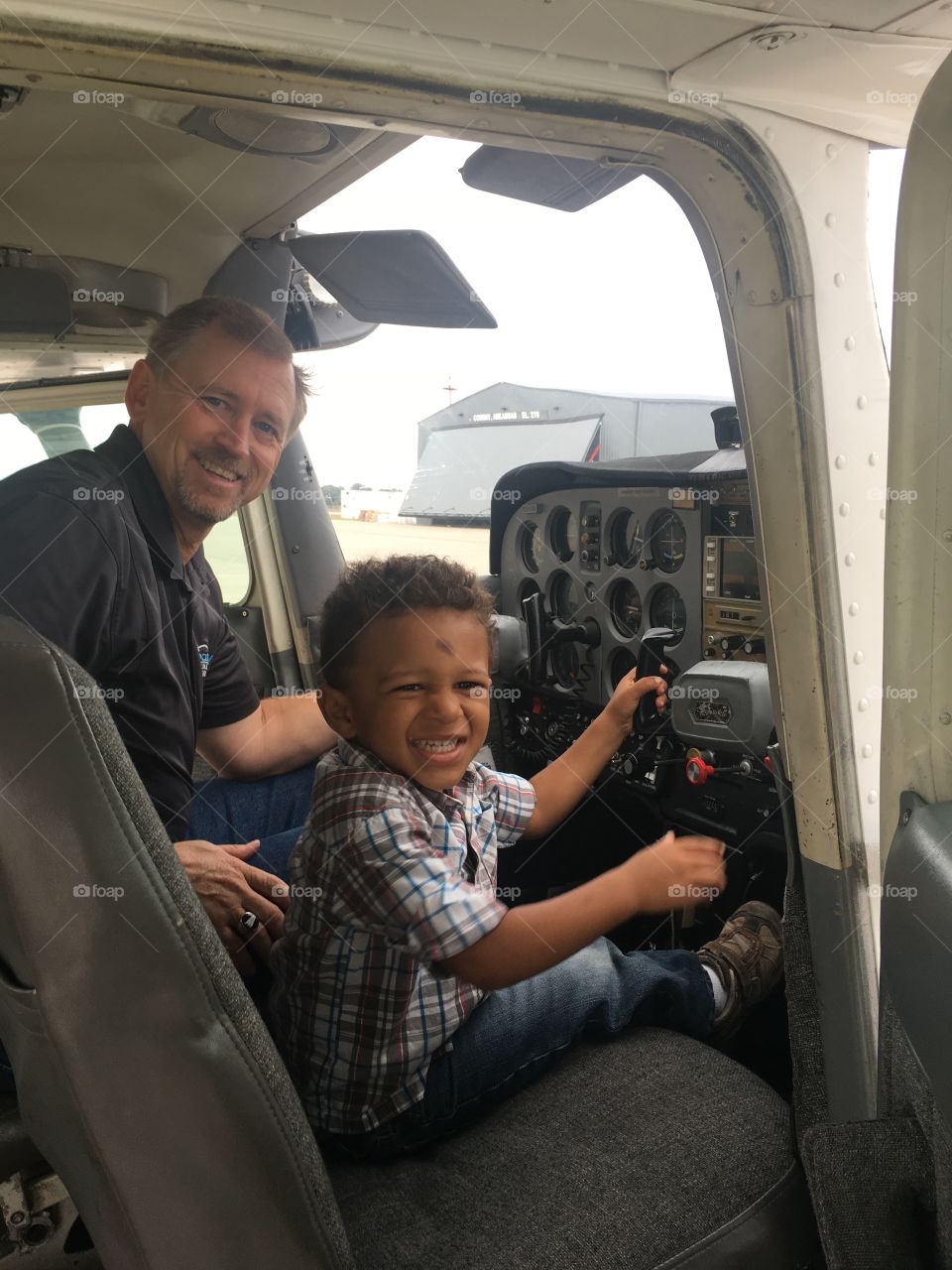 Riding with grandpa in his Cessna for the first time! My dad has 4 girls.. I'm the oldest and this is his first grand baby! My son.   He was so proud to take him flying. This moment only happens once. 
