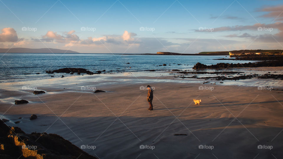 Man and his dog at the beach