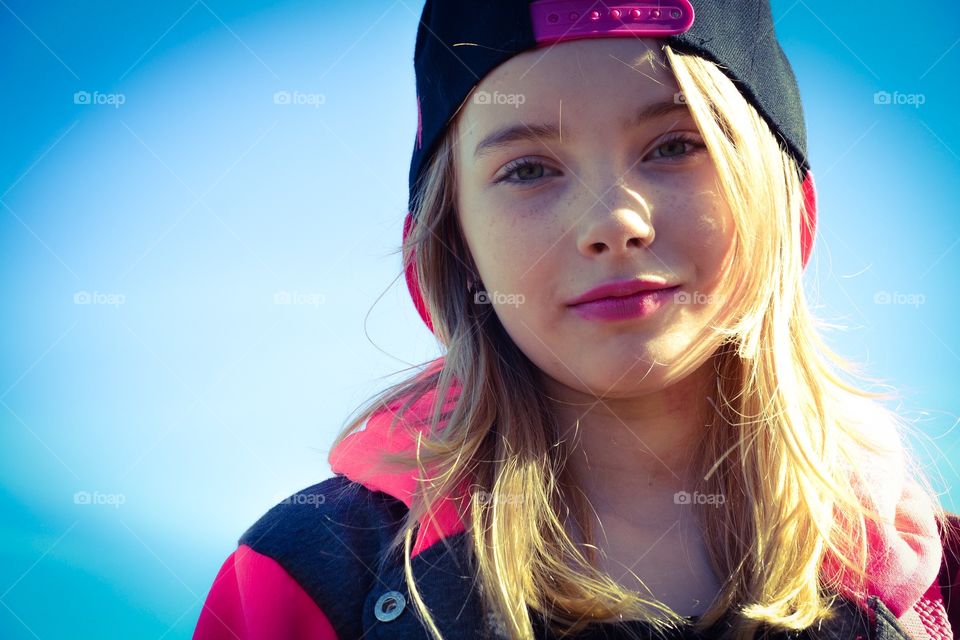 Girl. A young girl with the sky in the background