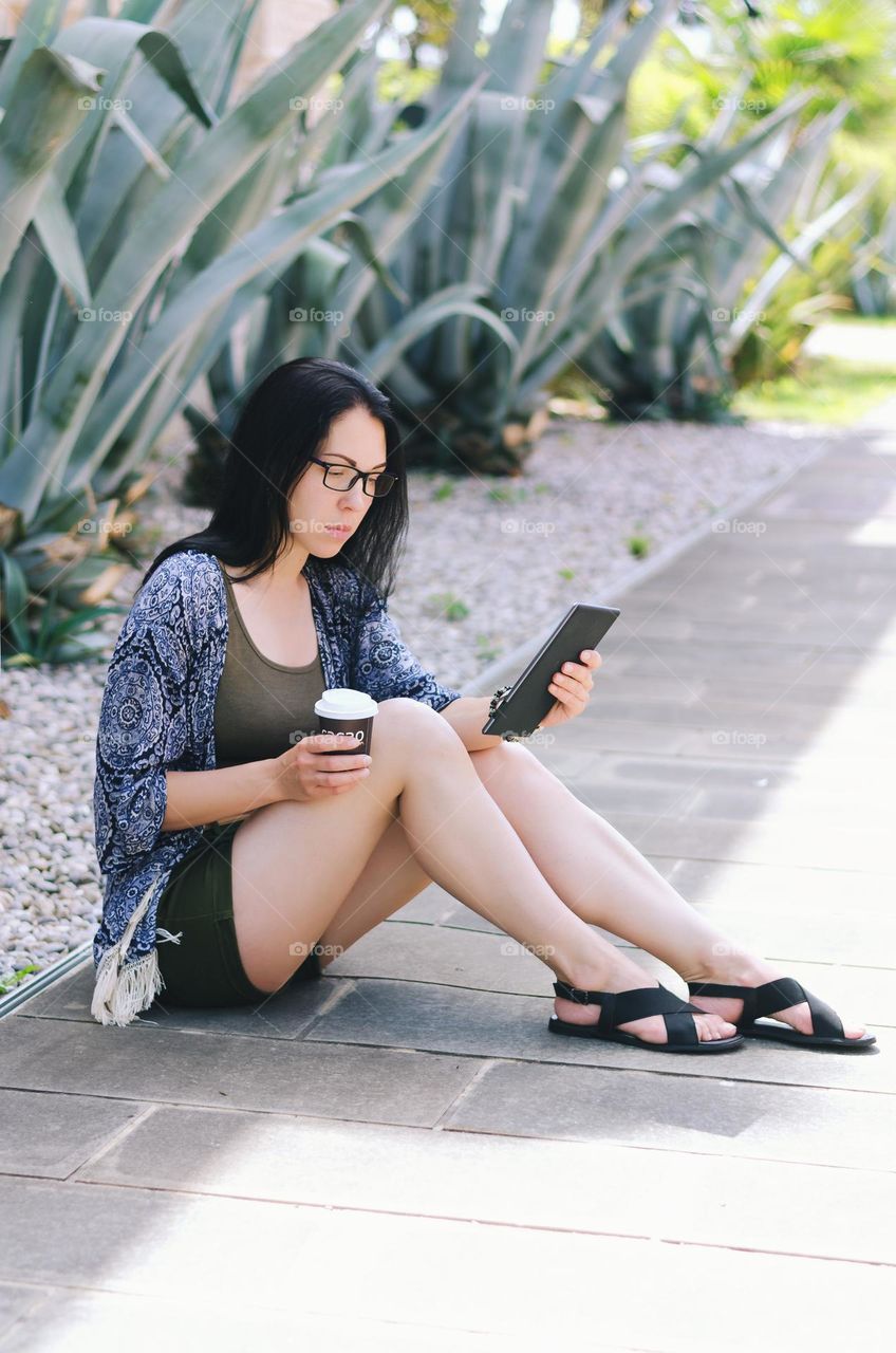 Portrait of young happy business woman relaxing, working in city, beach at Adriatic sea. Laptop. Technology. Selfie. Social media. Video call