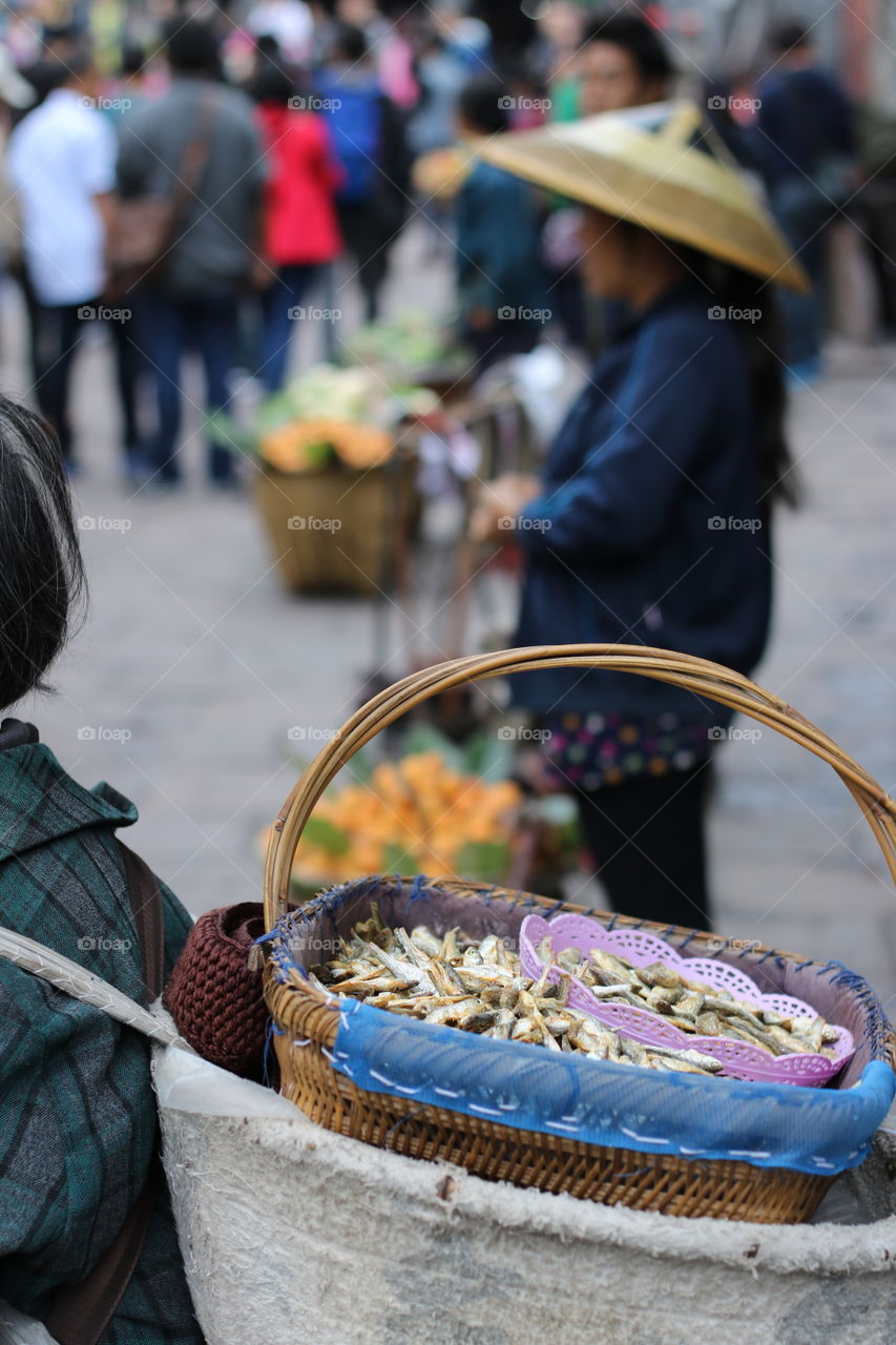 The woman sale some fish on the street in china 