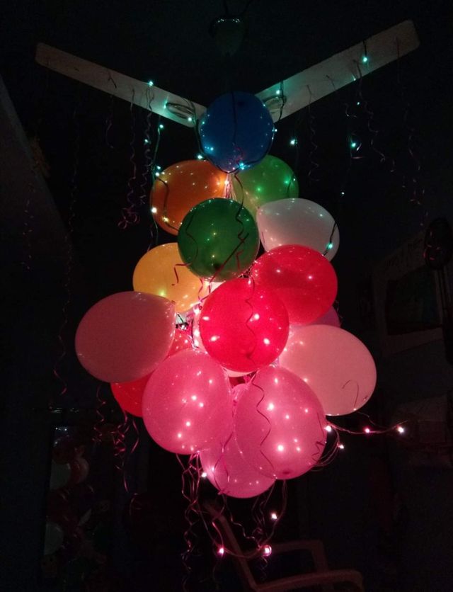 ballon hanging on fan... ribbon and lights..❤️