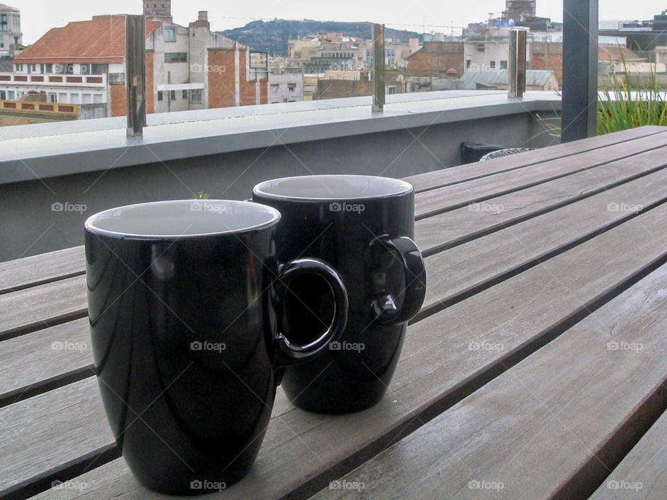 Coffee caps on the table in terrace with beautiful view