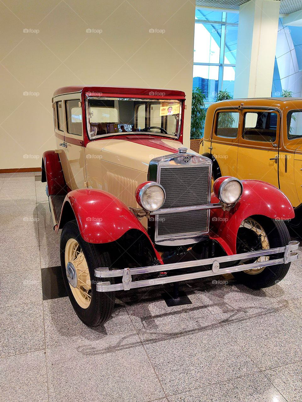 Red and beige car.  "Studebaker Erskine 50 Sedan".  USA. 1927.  Side view.  Retro cars