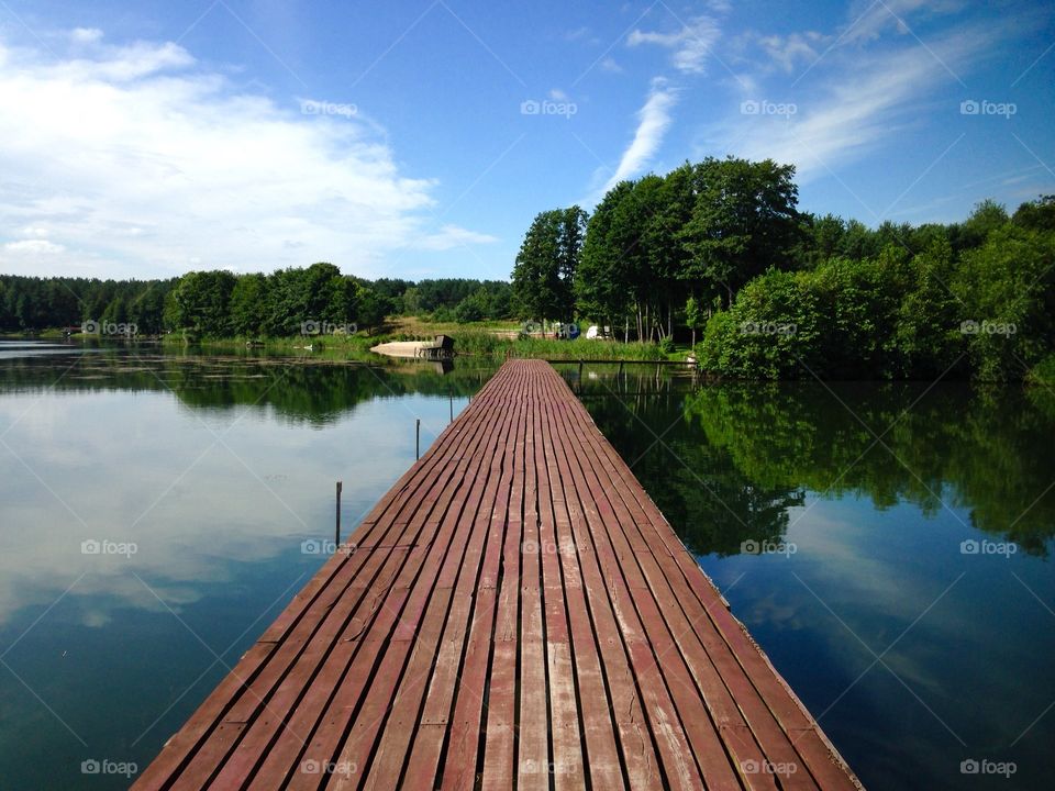 Wooden pier on the lake - summer trip to polish countryside 