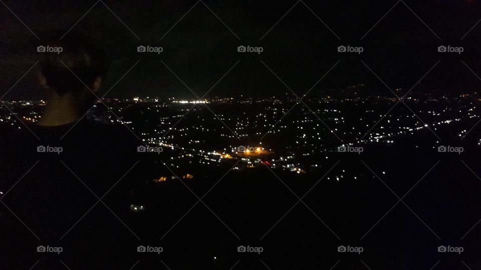 the atmosphere above looking at the city with the ambiance of the lights