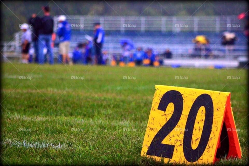 20 Yard Line. Closeup perspective of the 20 yard line in American football. 