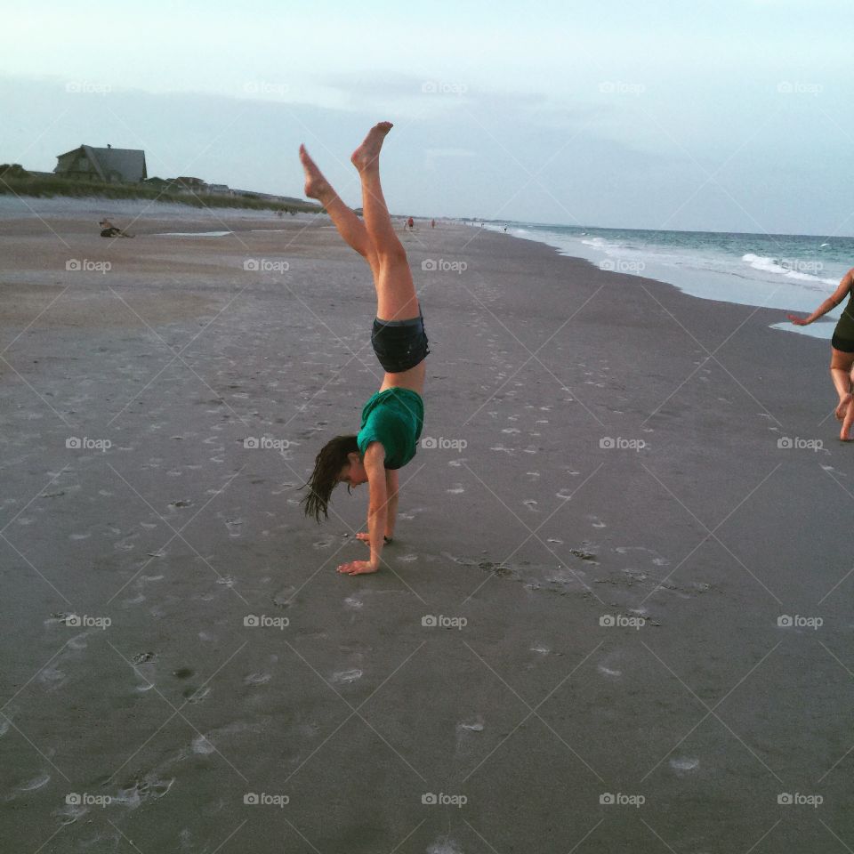 Handstand by the ocean 