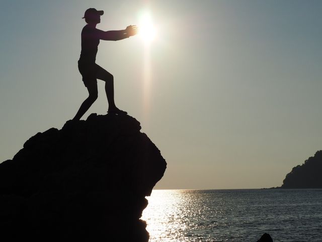 A silhouette photo trying to play with the sun. It was taken while I was traveling to the south of Thailand