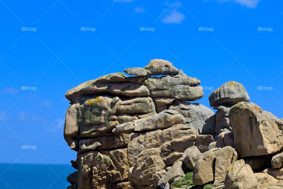 statue of a person on a rock