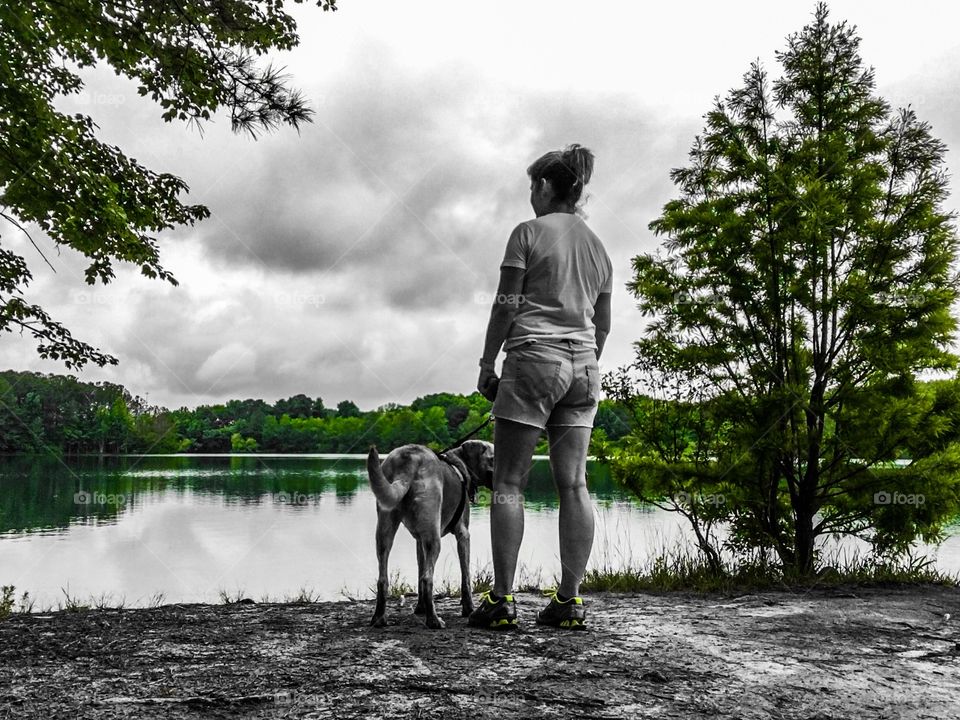 Rainy weather at the lake walking with the dog