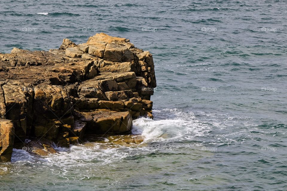 waves crashing on rocks