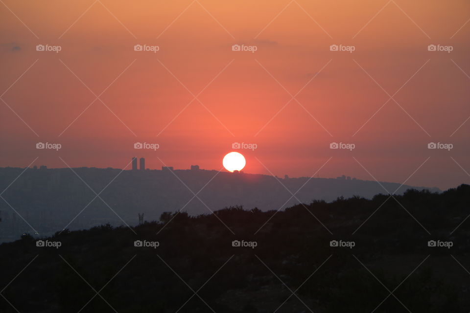 The sunset on the mountains of my country.