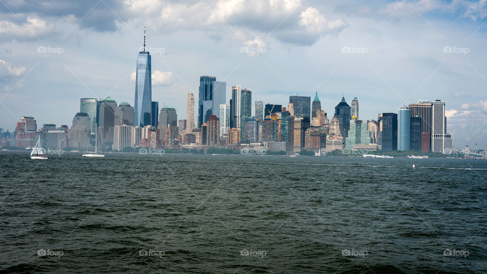 skyline and modern office buildings of Midtown Manhattan viewed from across the Hudson river, New York