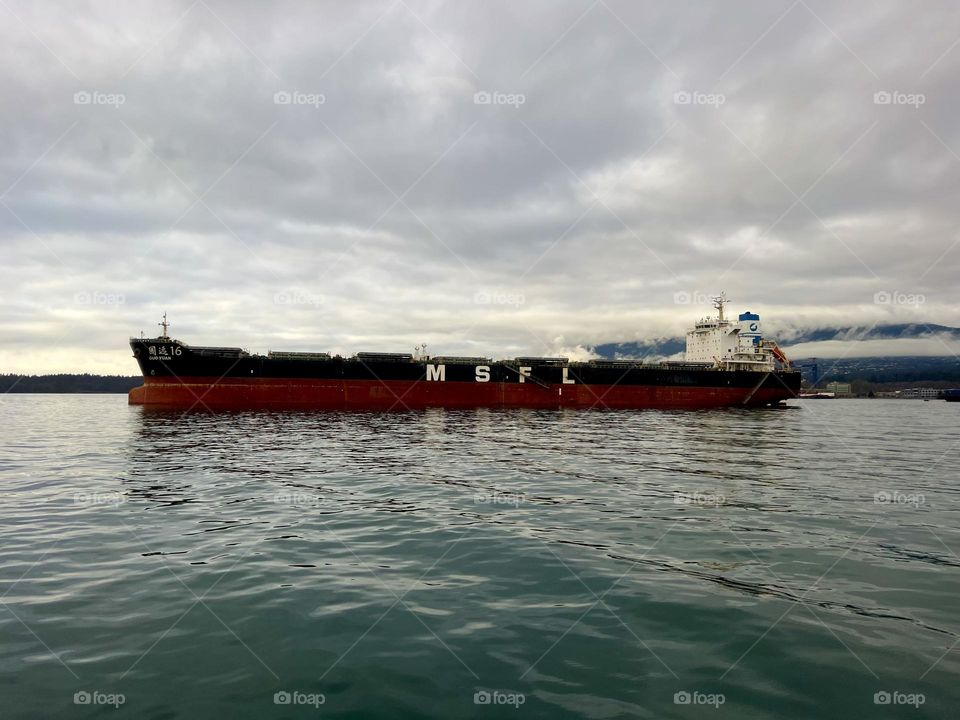 View of a Bulk carrier in the Vancouver Harbour from a SeaBus ferry 