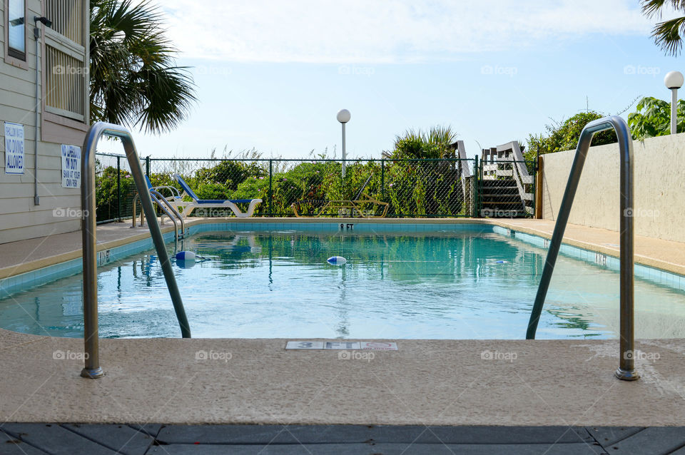 View of a pool from entry stairs