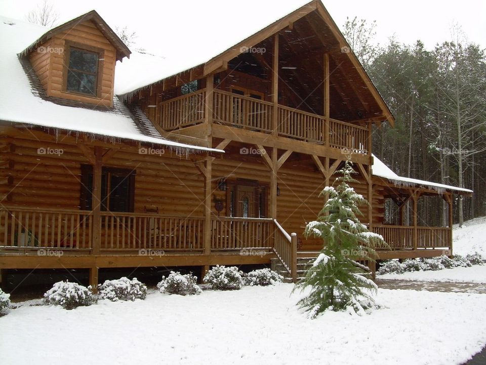 Log cabin in snow