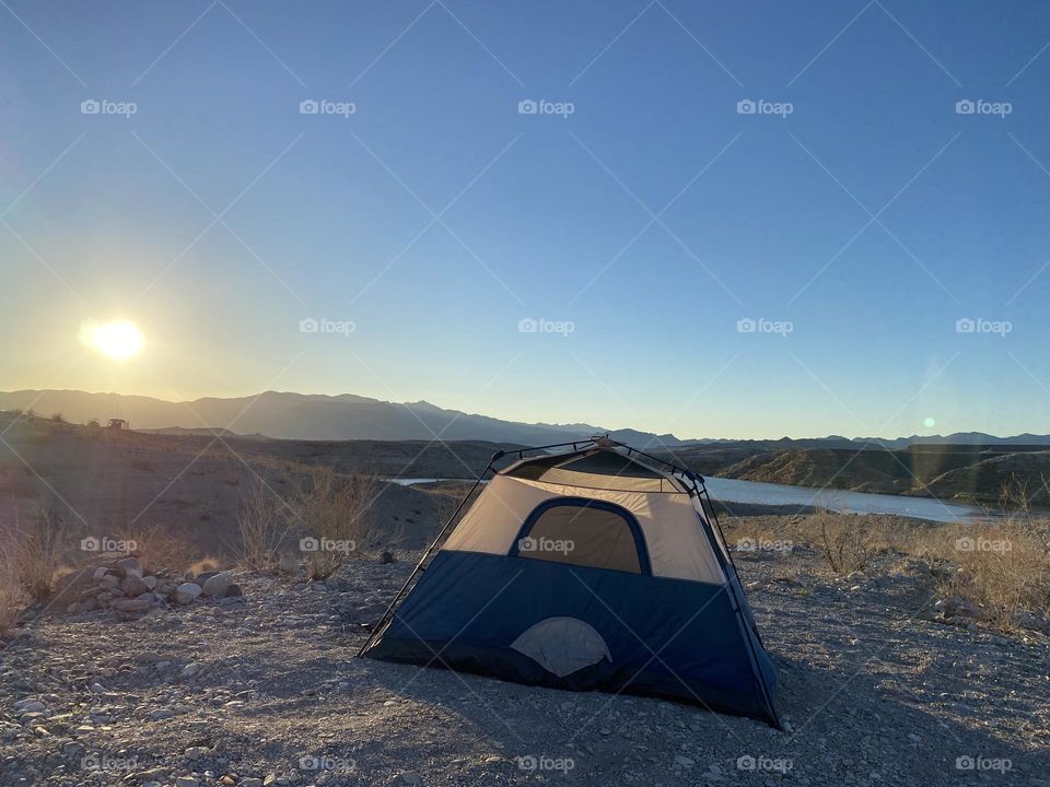Tent with sun and mountain